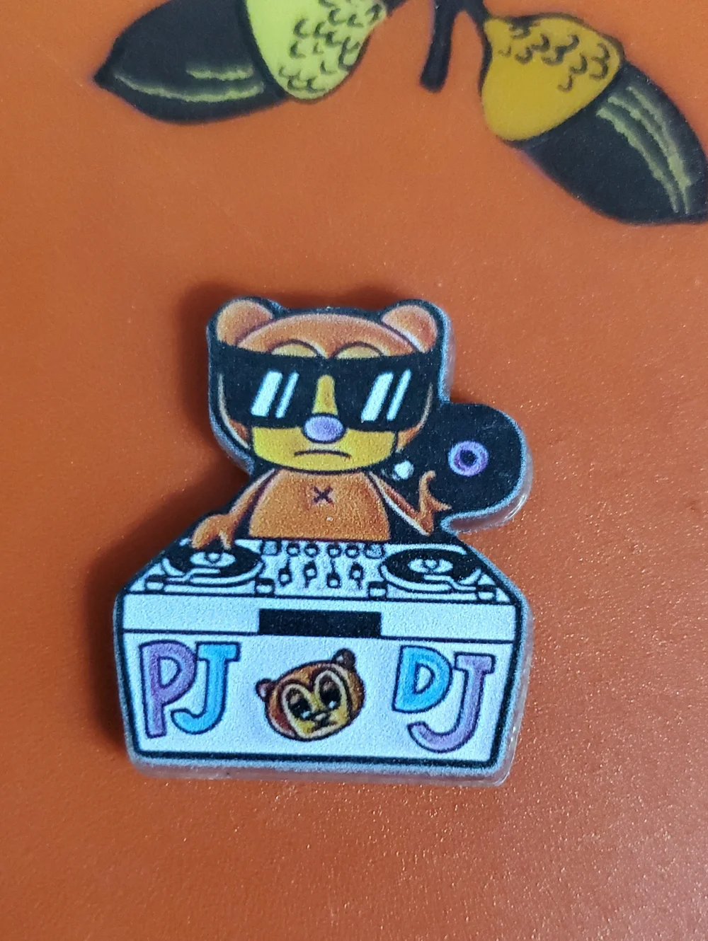 PJ Berri DJ Bear Acrylic Pin in Orange, Black & White